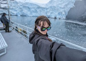 Senior Deckhand Emma in front of a glacier